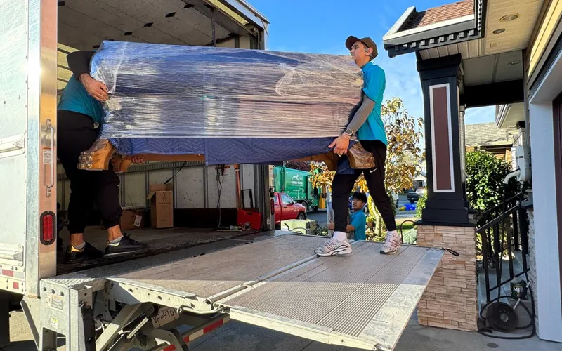 A long-distance move gets a real quote based on inventory and route, not a flat number Moving truck being loaded for a long-distance move