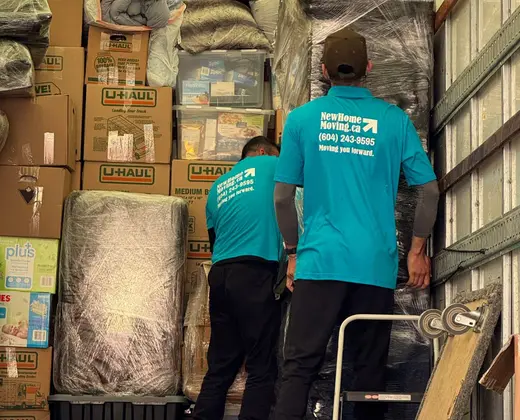 A New Home Moving truck loaded with boxes and furniture, ready for the road