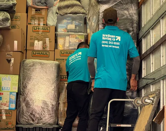 A moving truck loaded with wrapped furniture and boxes