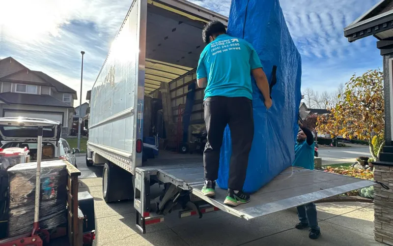 A cross-country shipment is quoted on real inventory and access at both ends Large item being loaded onto a moving truck with a liftgate